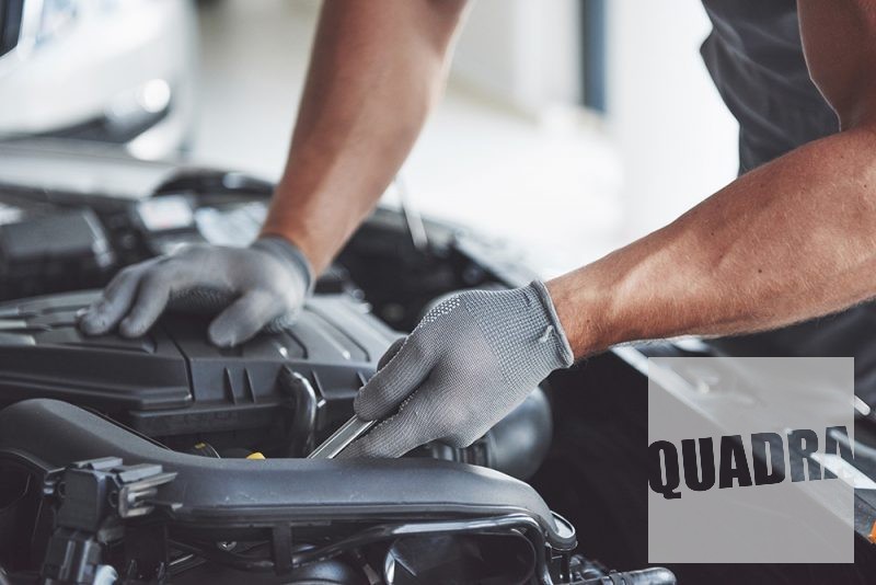 Auto mechanic working in garage. Repair service